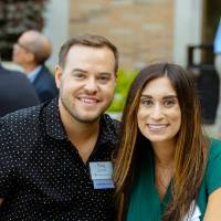 A couple posing outside.